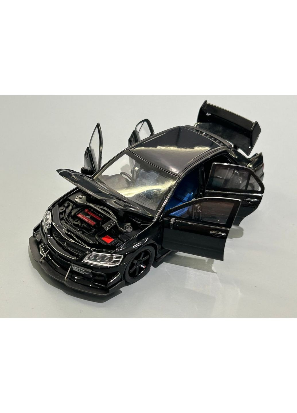 Машинка металлическая Авто Эксперт Mitsubishi Lancer Evo 1:32 открываются двери капот багажник свет/звук Черная (82501) No Brand (371646995)