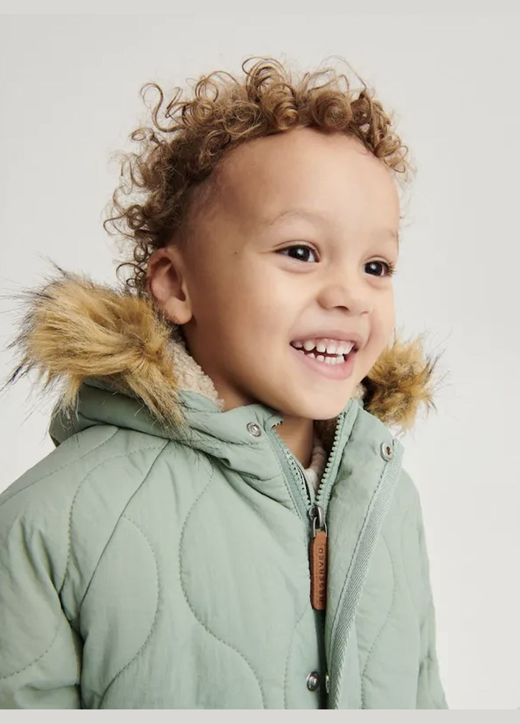 Светло-зеленая зимняя детская зимняя курточка Reserved Курточка на шерпі