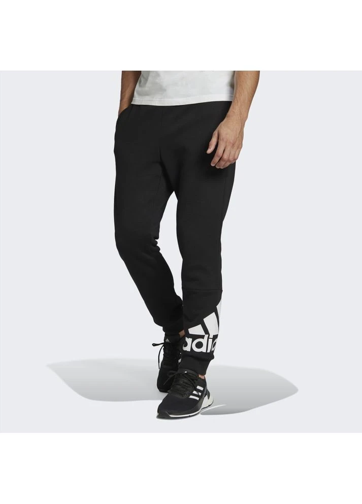 Штани Essentials Fleece Tapered Cuff Logo Pants Black GK8966 adidas (397854364)