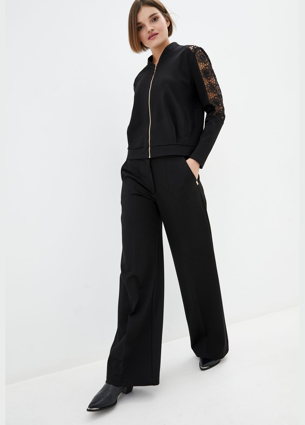 Трикотажний жіночий костюм чорного кольору зі вставками з мережива. ORA (282737175)