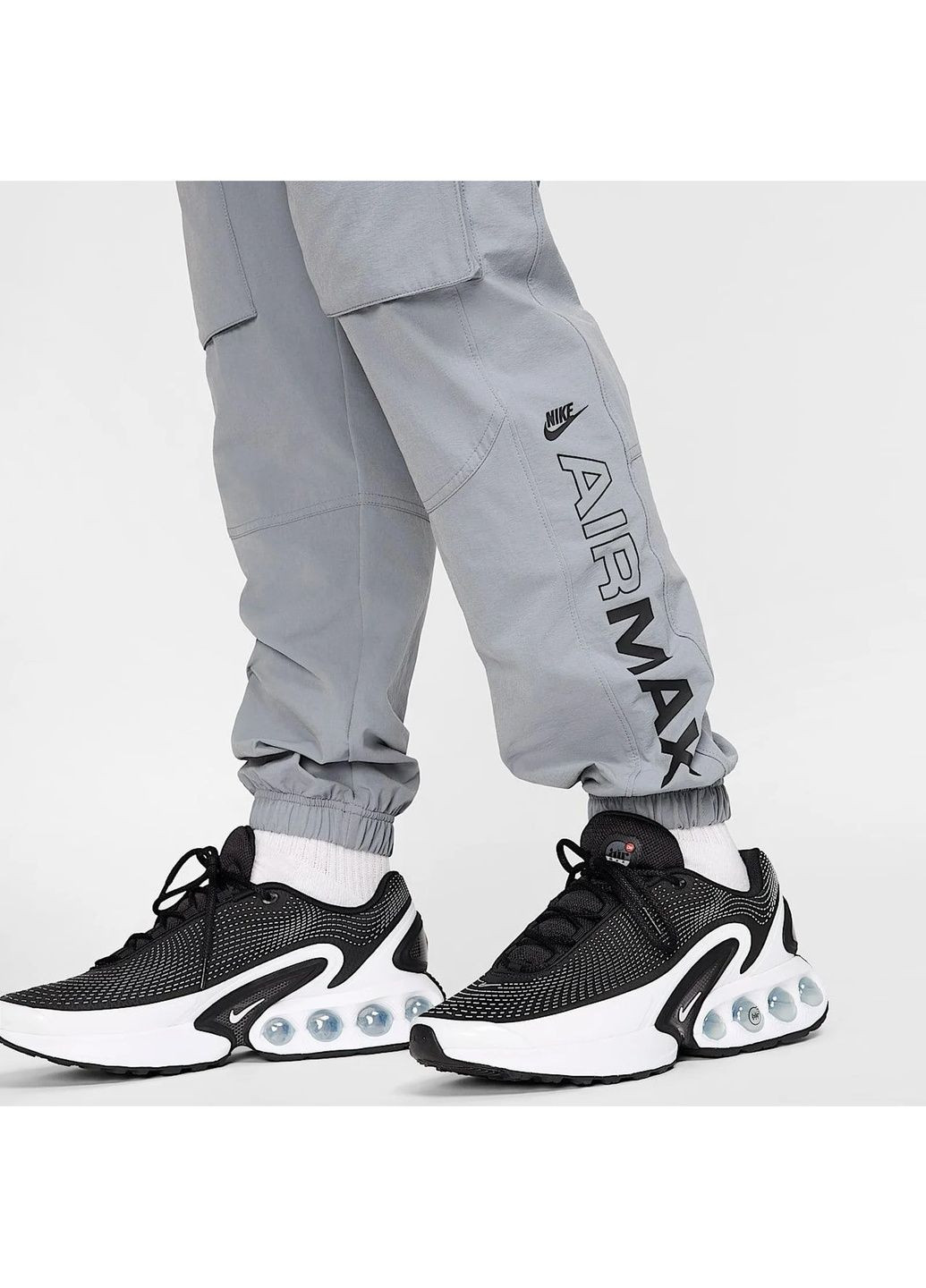 Серые демисезонные брюки Nike