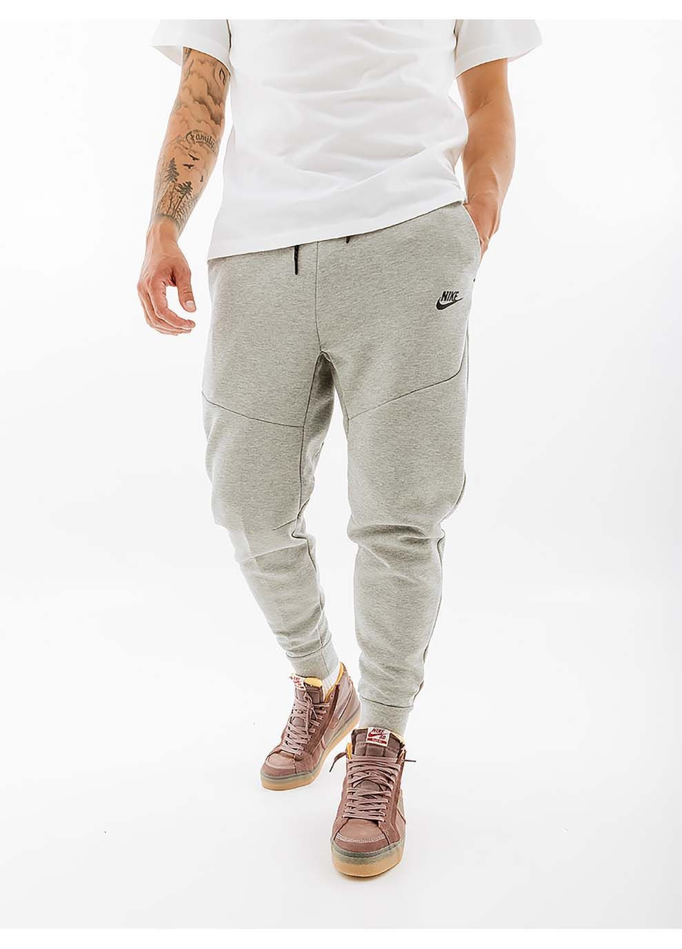 Серые демисезонные брюки Nike