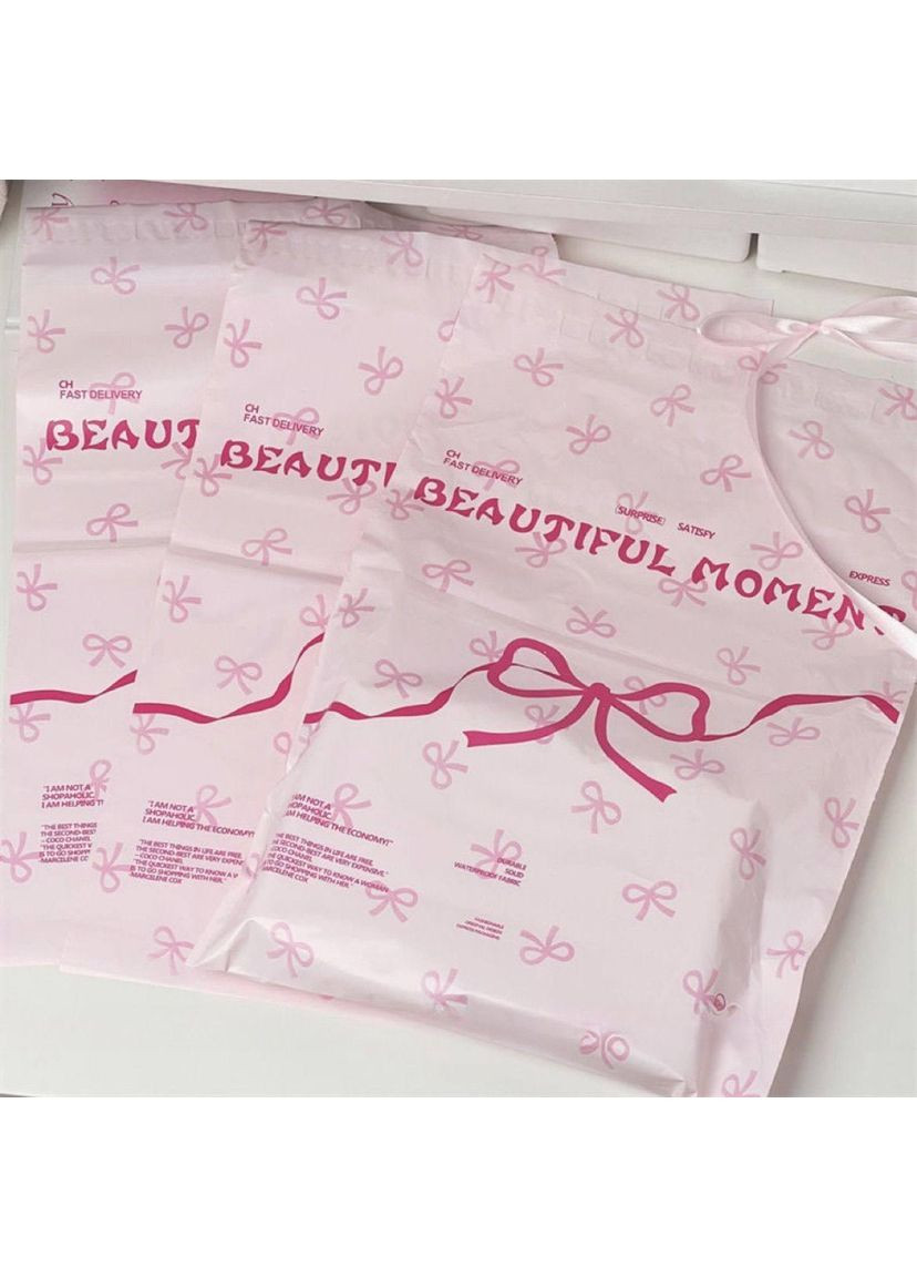 Кур'єрські пакети рожеві з бантом 28×43 см, поліетиленові пакети для відправлень, самоклеючі No Brand (366890490)