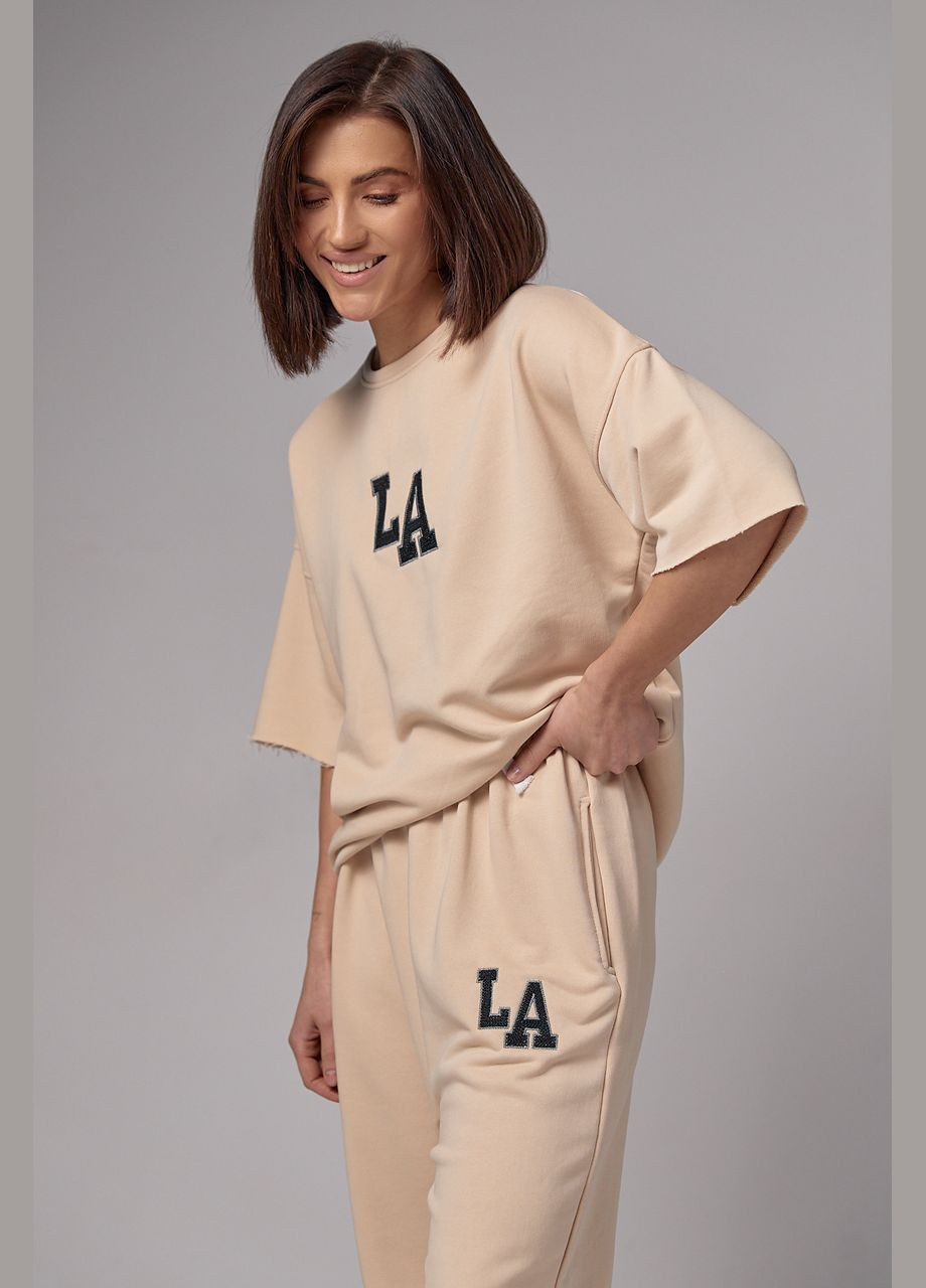 Жіночий спортивний костюм із вишивкою LA - кремовий Lurex (289060703)