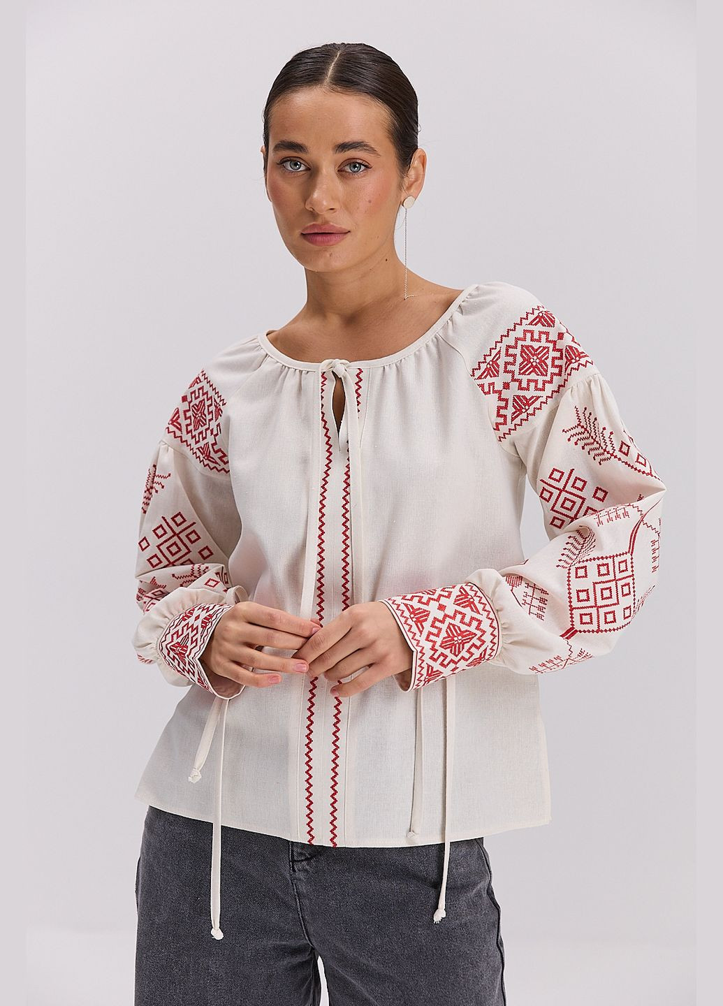 Біла жіноча вишиванка з геометрією гладдю і зав'язками на манжентах Arjen (322877509)