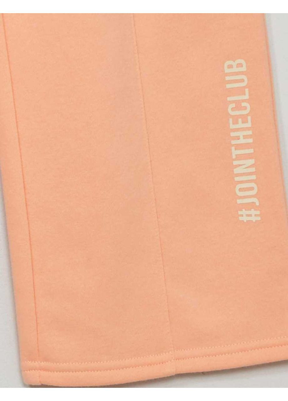 Персиковые брюки Kiabi