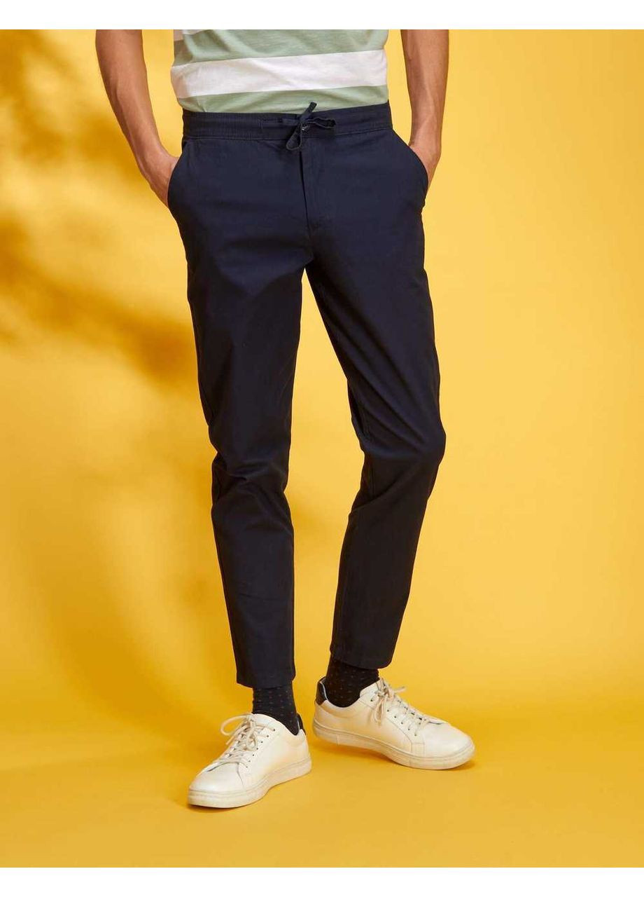 Темно-синие брюки Kiabi