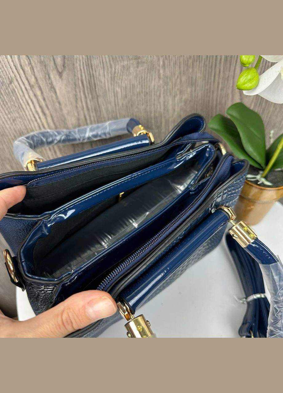 Жіноча сумочка під рептилію, лакова екошкіра, трапеція, регульовані лямки чорна (sku_1327Ч) No Brand (330575617)