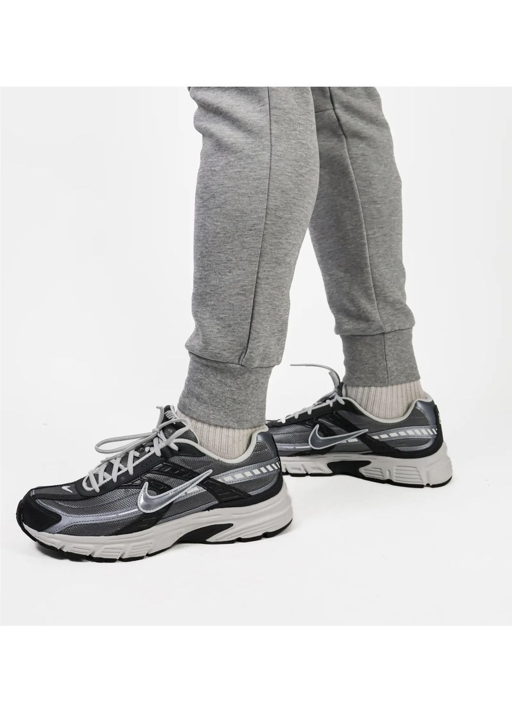 Серые демисезонные брюки Nike