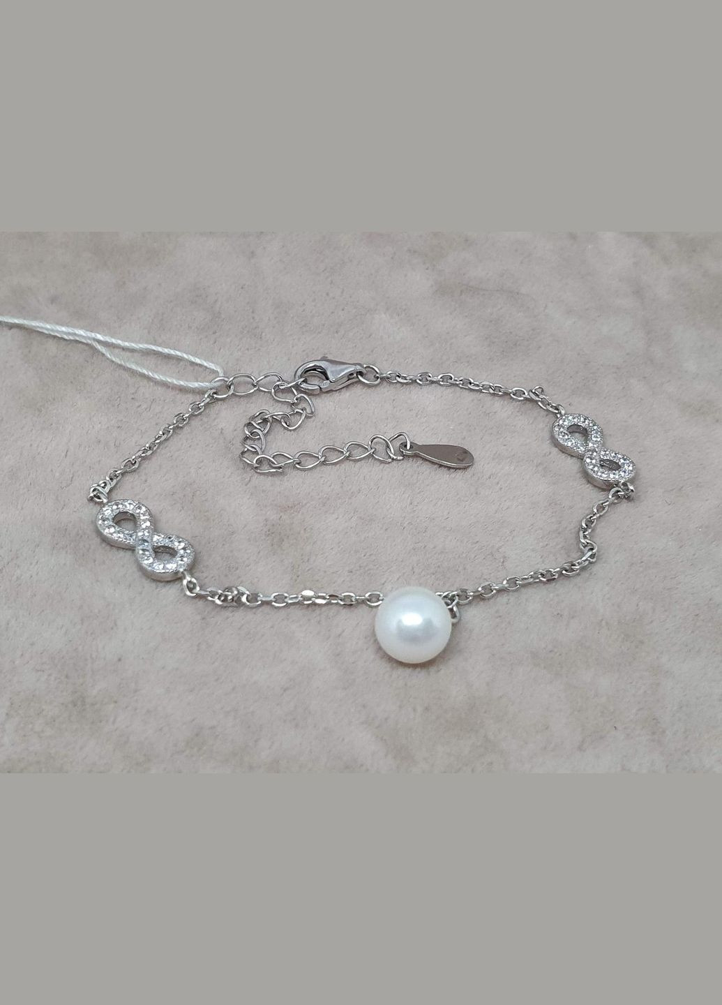 Серебряный браслет Безконечность с фианитами и жемчугом. 550061Б Top Silver (316699548)
