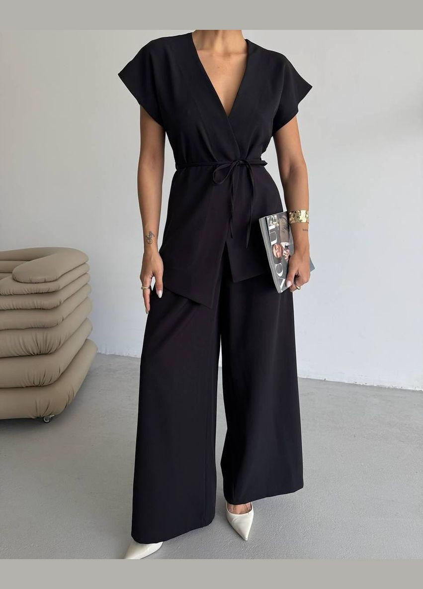 Черный демисезонный женский костюм с жилеткой и брюками свободного кроя. Avanti