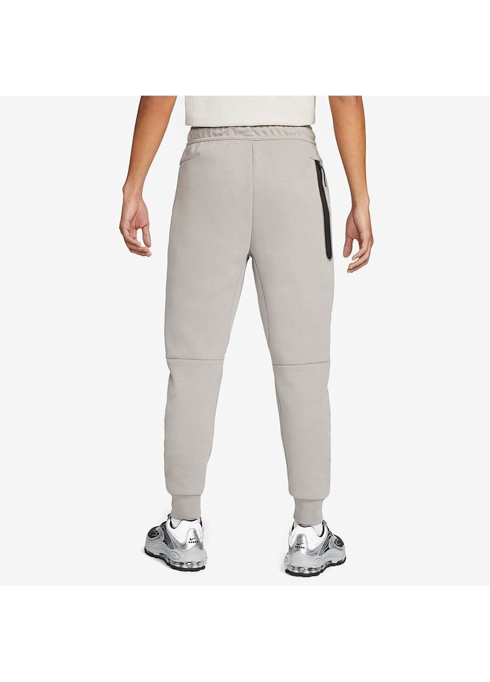 Серые демисезонные брюки Nike