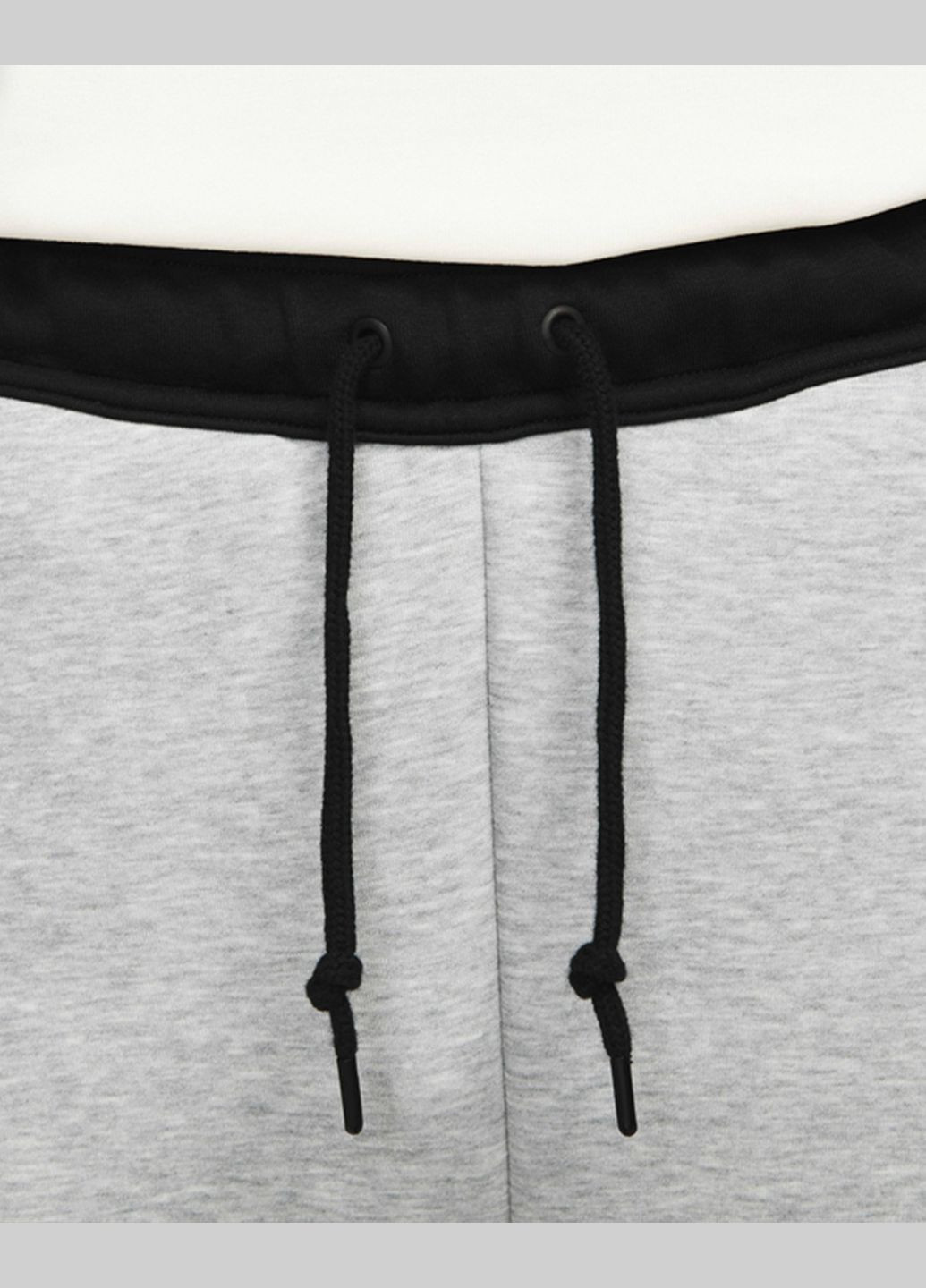 Серые демисезонные брюки Nike