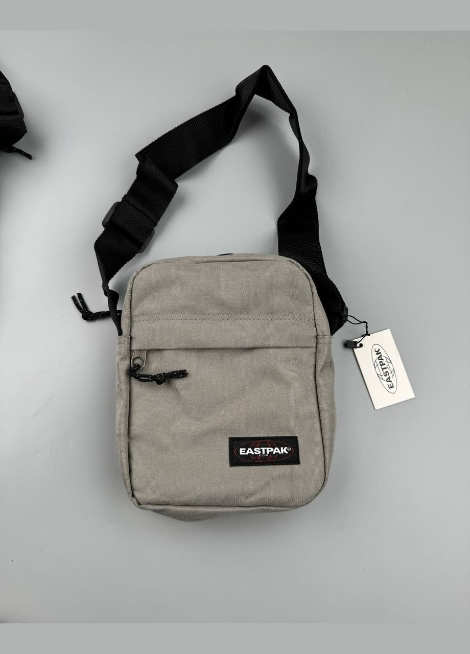Барсетка сірого кольору Eastpak (345642281)