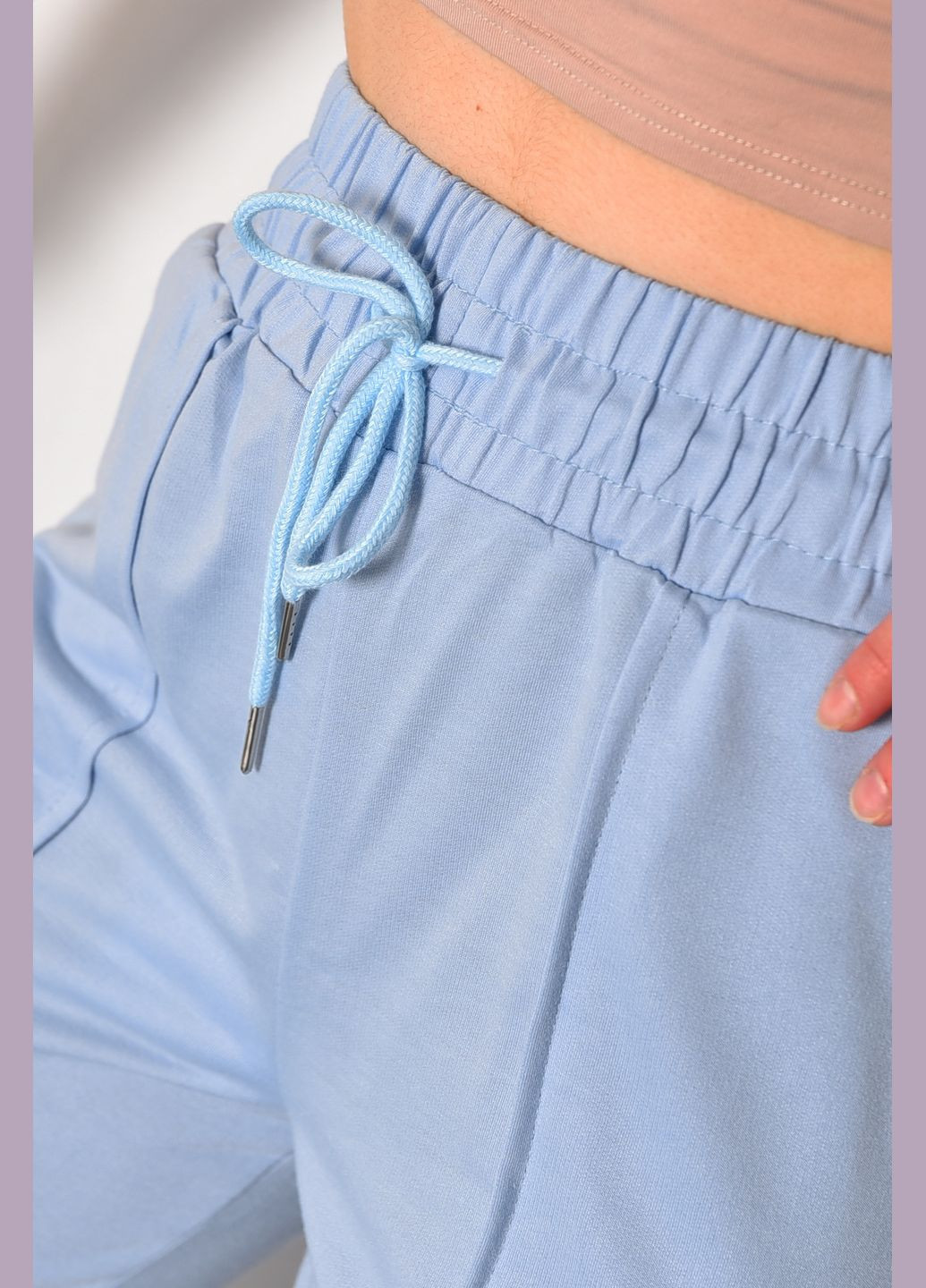 Спортивні штани жіночі блакитного кольору Let's Shop (286761522)