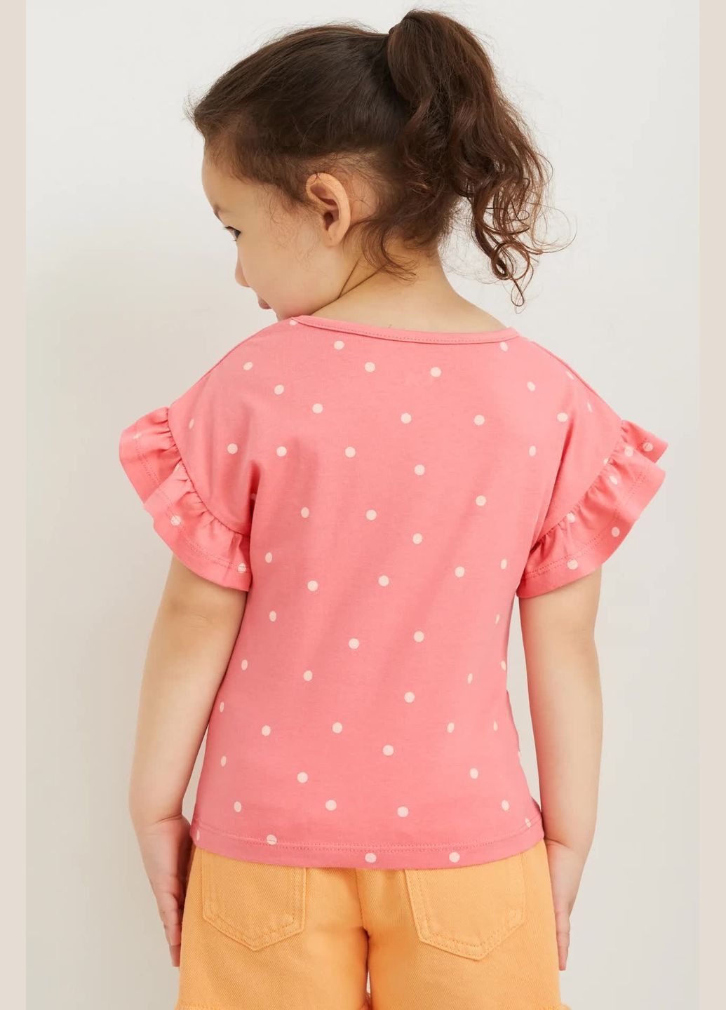 Розовая летняя футболка с принтом пайетки C&A
