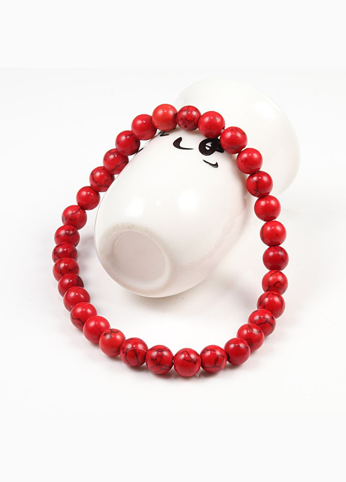 Жіночий браслет на руку з червоного говлиту на гумці No Brand (309037130)