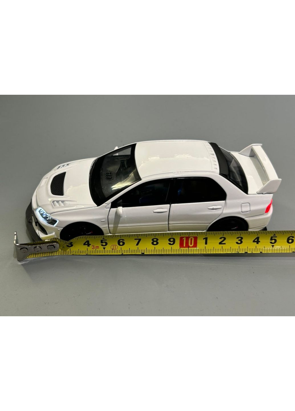 Машинка металлическая Авто Эксперт Mitsubishi Lancer Evo 1:32 открываются двери капот багажник свет/звук Белая (82501) No Brand (371646998)