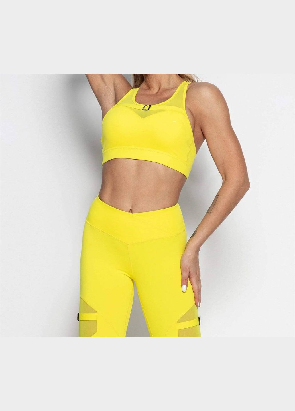 Спортивный костюм «с пряжкой на ноге» (топ и леггинсы) без пуш-ап эффекта желтого цвета, размер M Trends (330757036)
