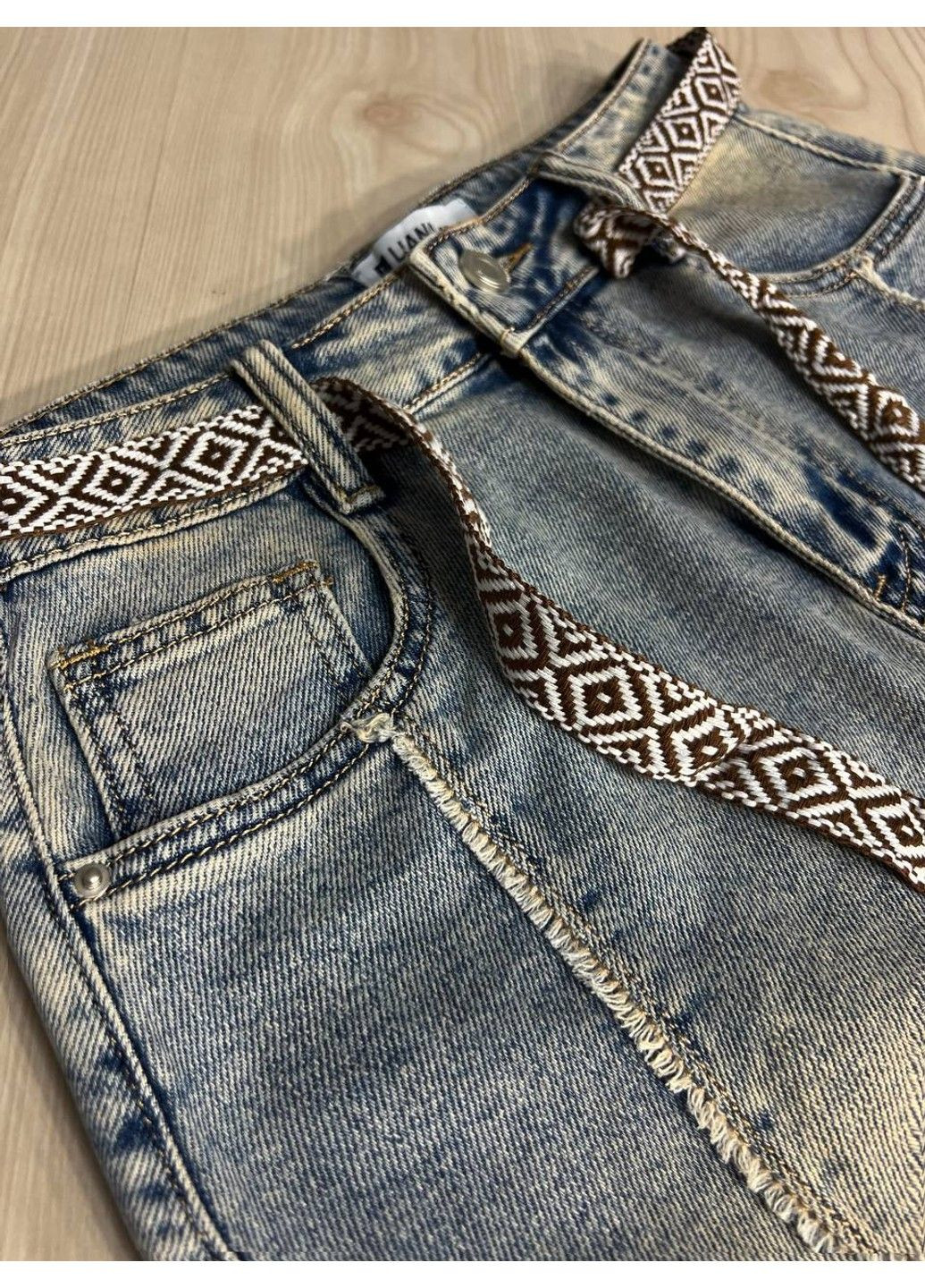 Спідниця жіноча джинсова Liana 426 середньої довжини з бахромою та етнопоясом блакитна Lian (336213234)