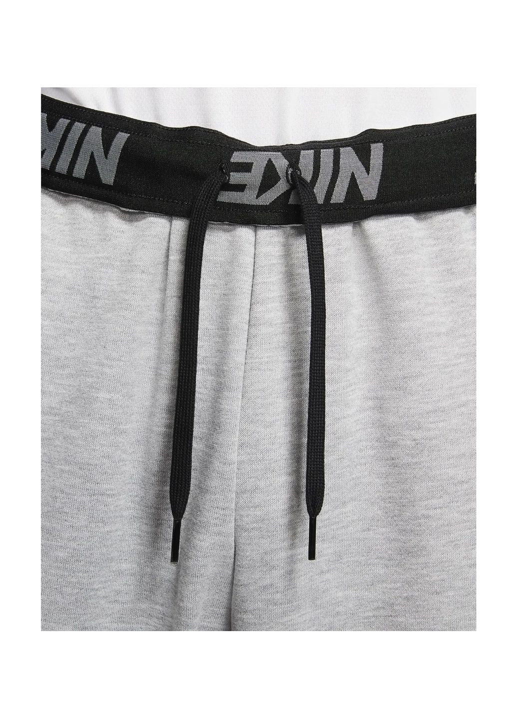 Серые демисезонные брюки Nike