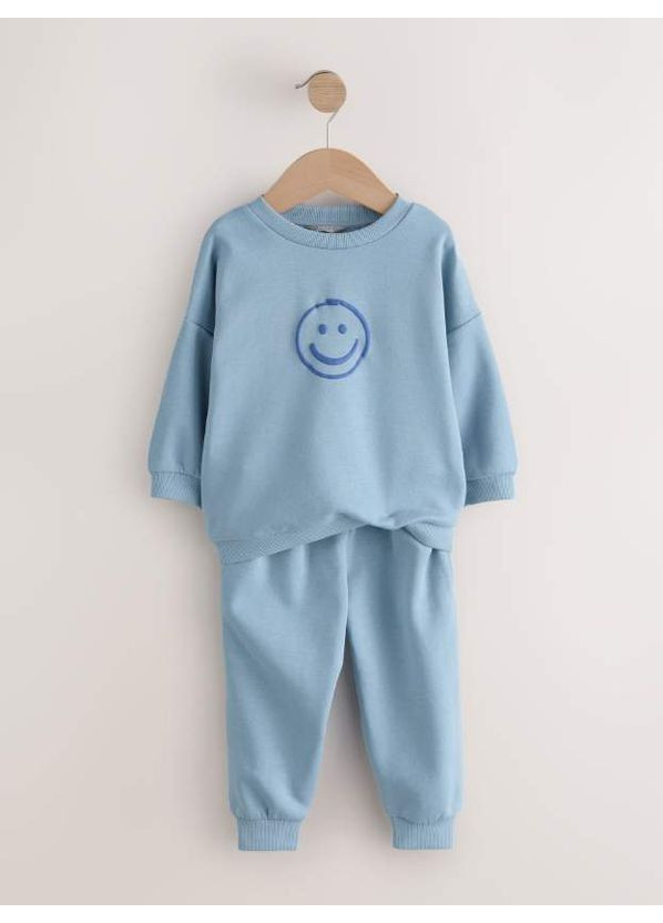 Коричневий демісезонний комплект оверсайз на флісі light blue/smile Next Trend 7074~01