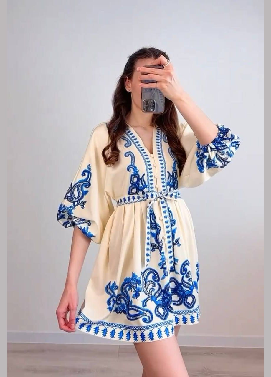 Блакитна повсякденний, коктейльна, вечірня сукня з орнаментом на запах Garna з орнаментом