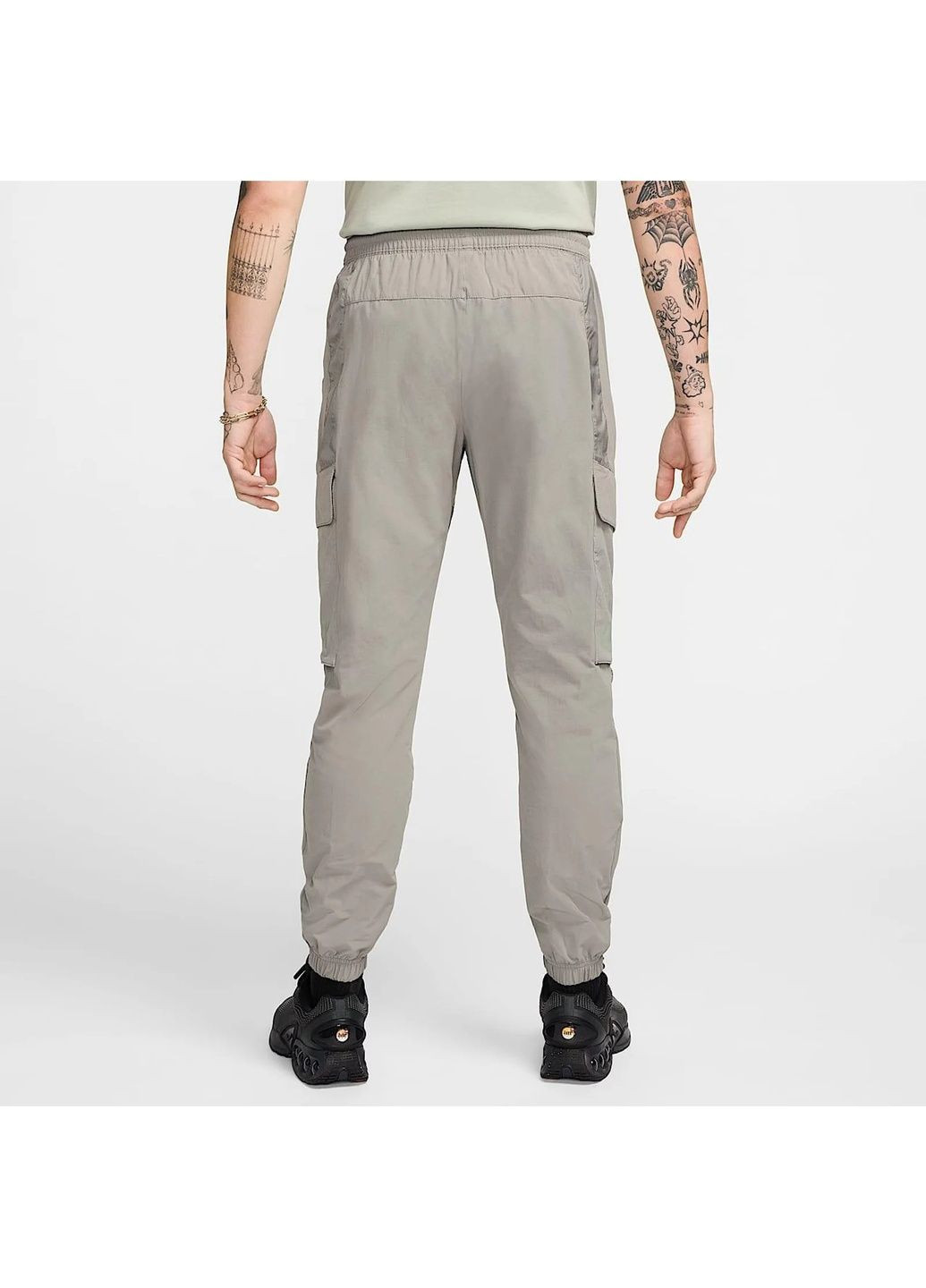 Серые демисезонные брюки Nike