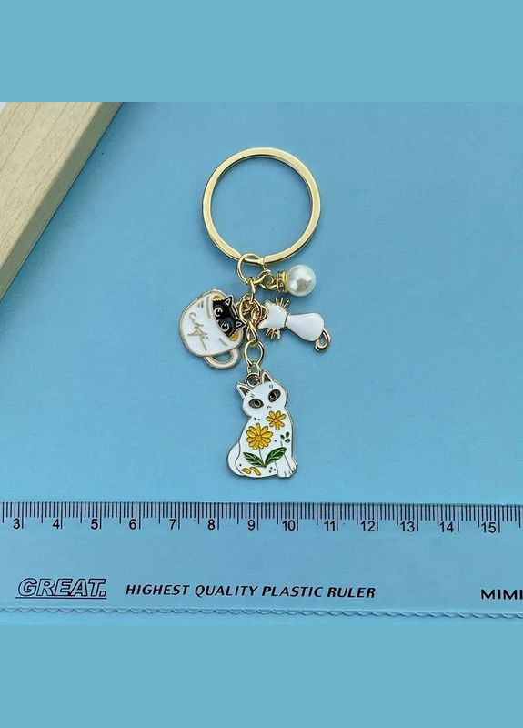 Брелок золотистий з підвісками котики LuxAurum305 Liresmina Jewelry (347151311)