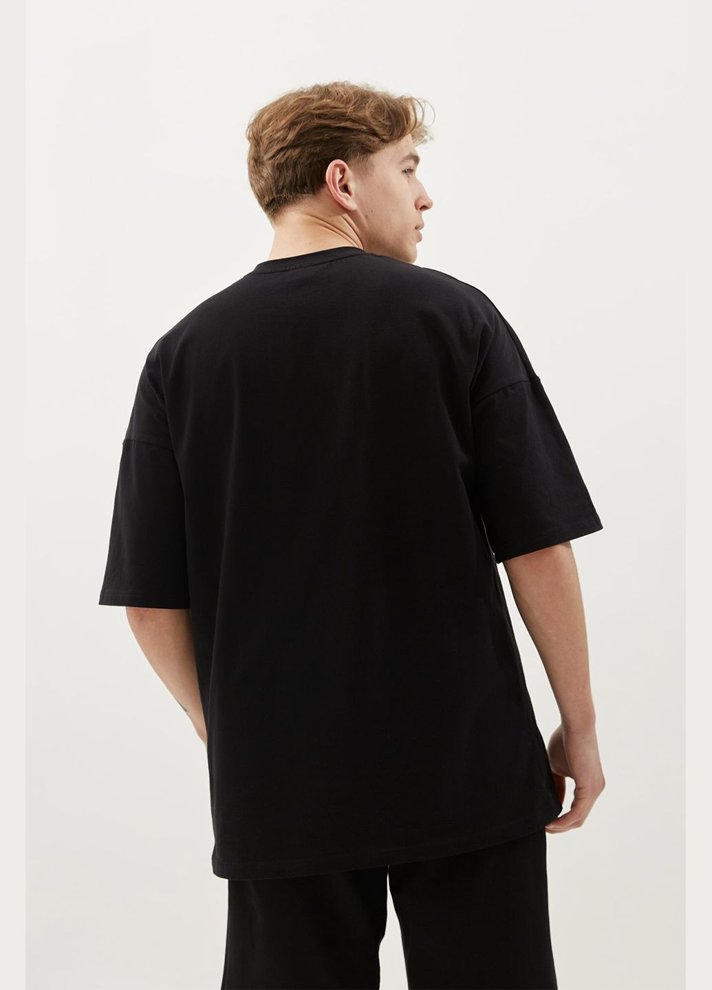 Чорна оверсайз футболка directed by robert b. weide Gen