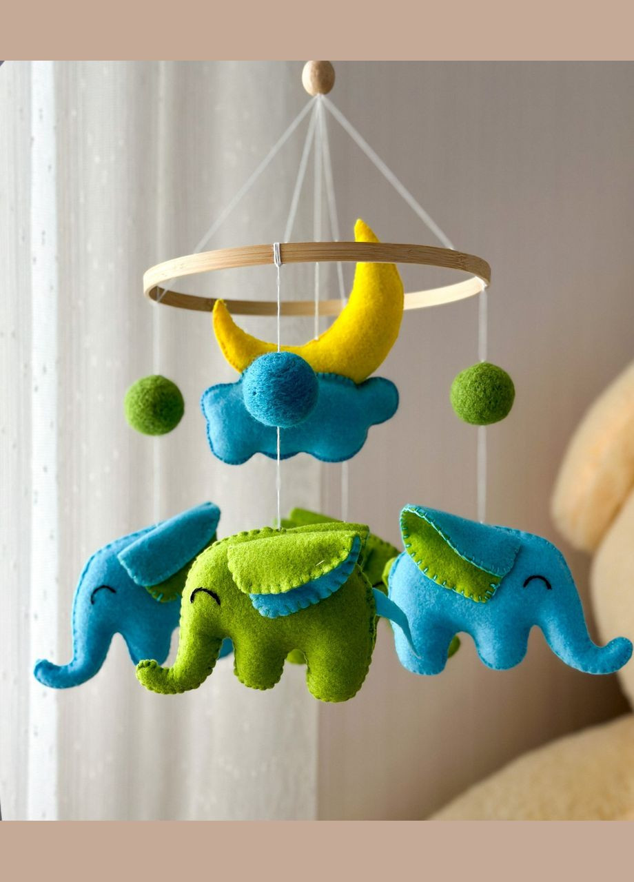 Дитячий музичний мобіль на ліжечко для немовлят WooolyWool «Слоненята» з 35 мелодіями No Brand (342757890)