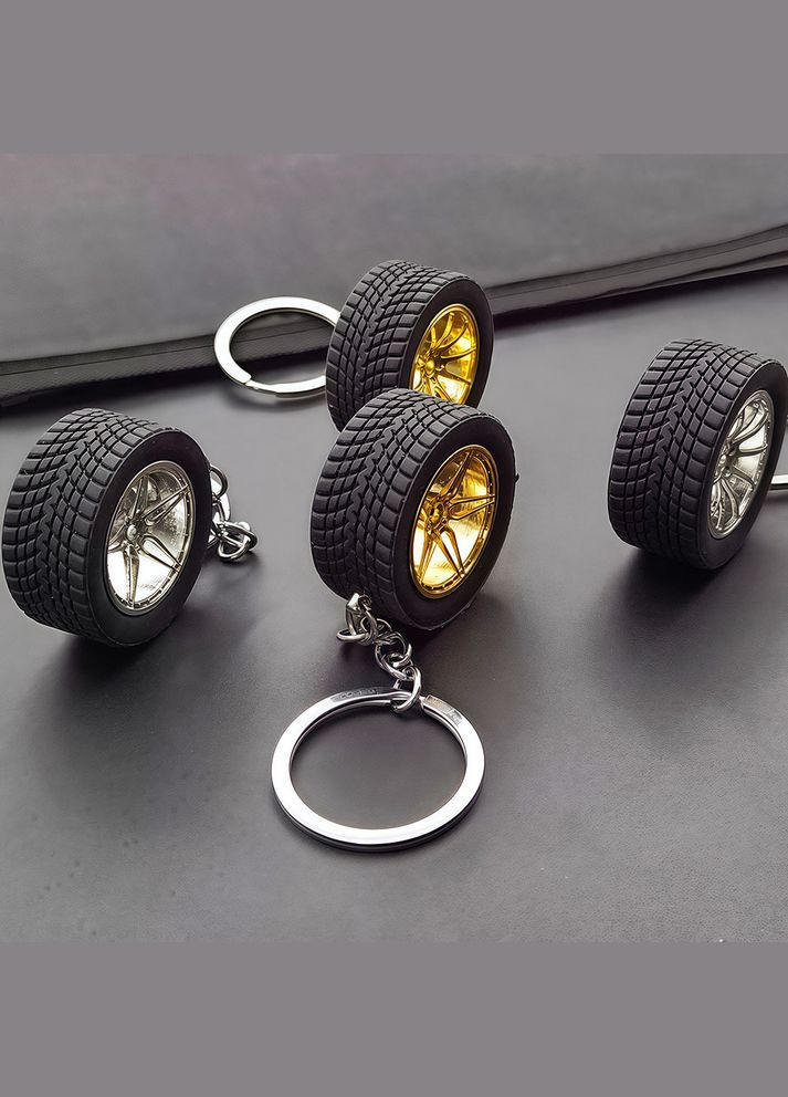 Брелок у вигляді автомобільного колеса з золотим диском No Brand (346440127)