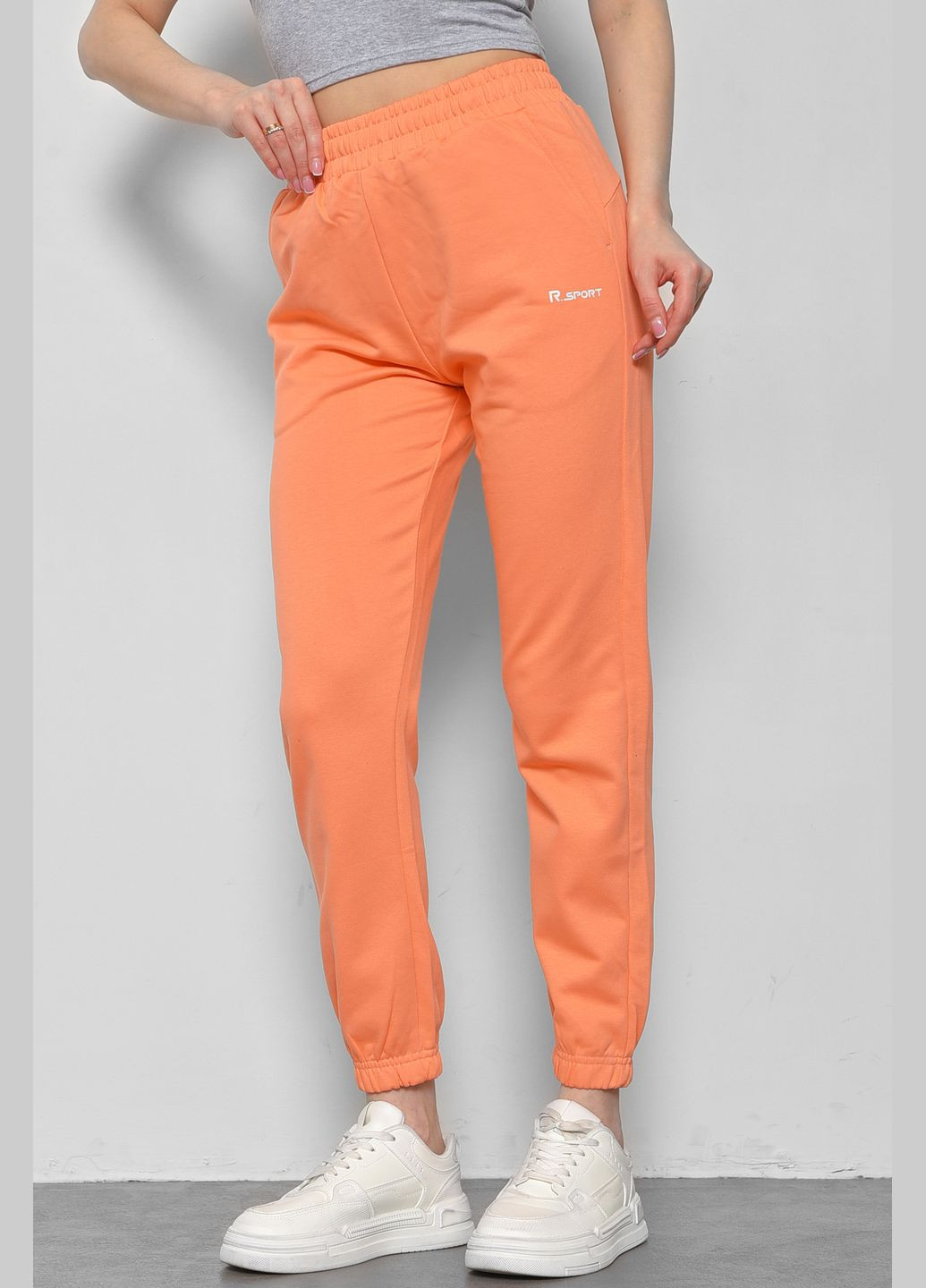 Спортивні штани жіночі коралового кольору Let's Shop (291683203)