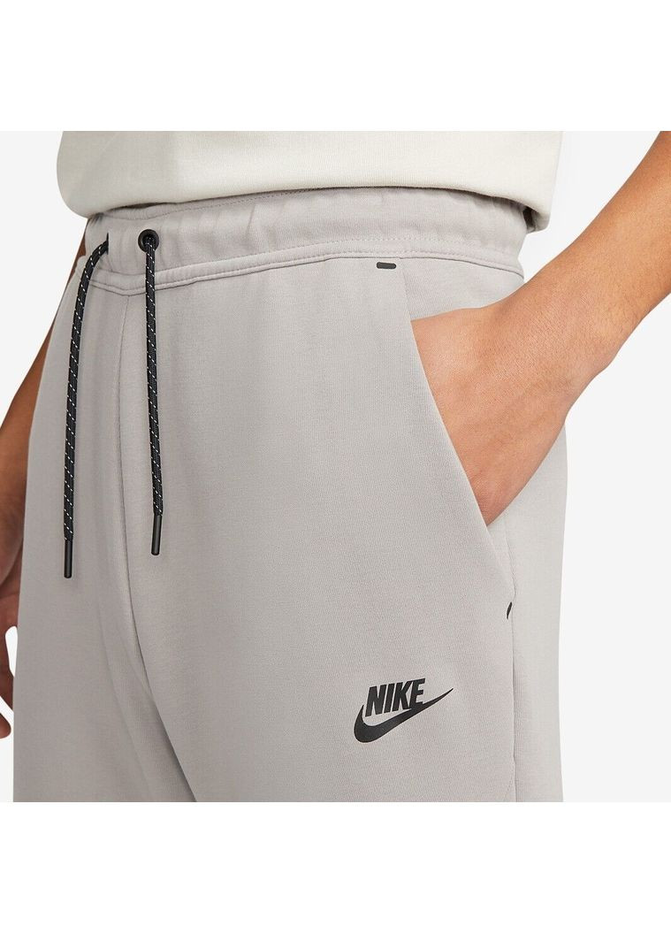 Серые демисезонные брюки Nike