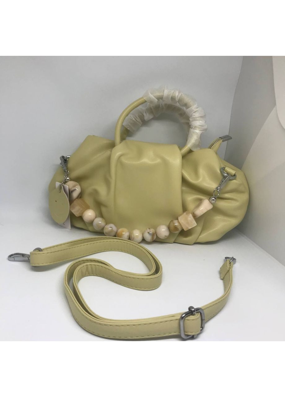 Жіноча сумка з еко шкіри темно-жовта з регульованим ремінцем стильна сумочка для повсякденного використання New Trend (304990683)