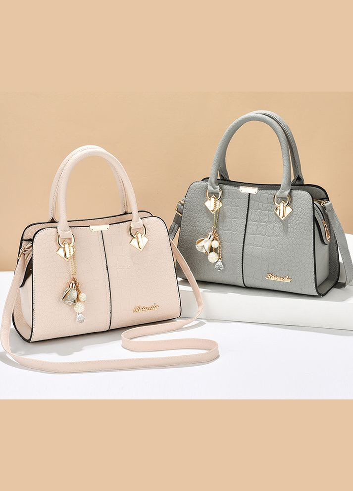 Жіноча сумка класична трапецієподібна з екошкіри з брелком зміїний принт молочний (sku_1458М) No Brand (330576155)