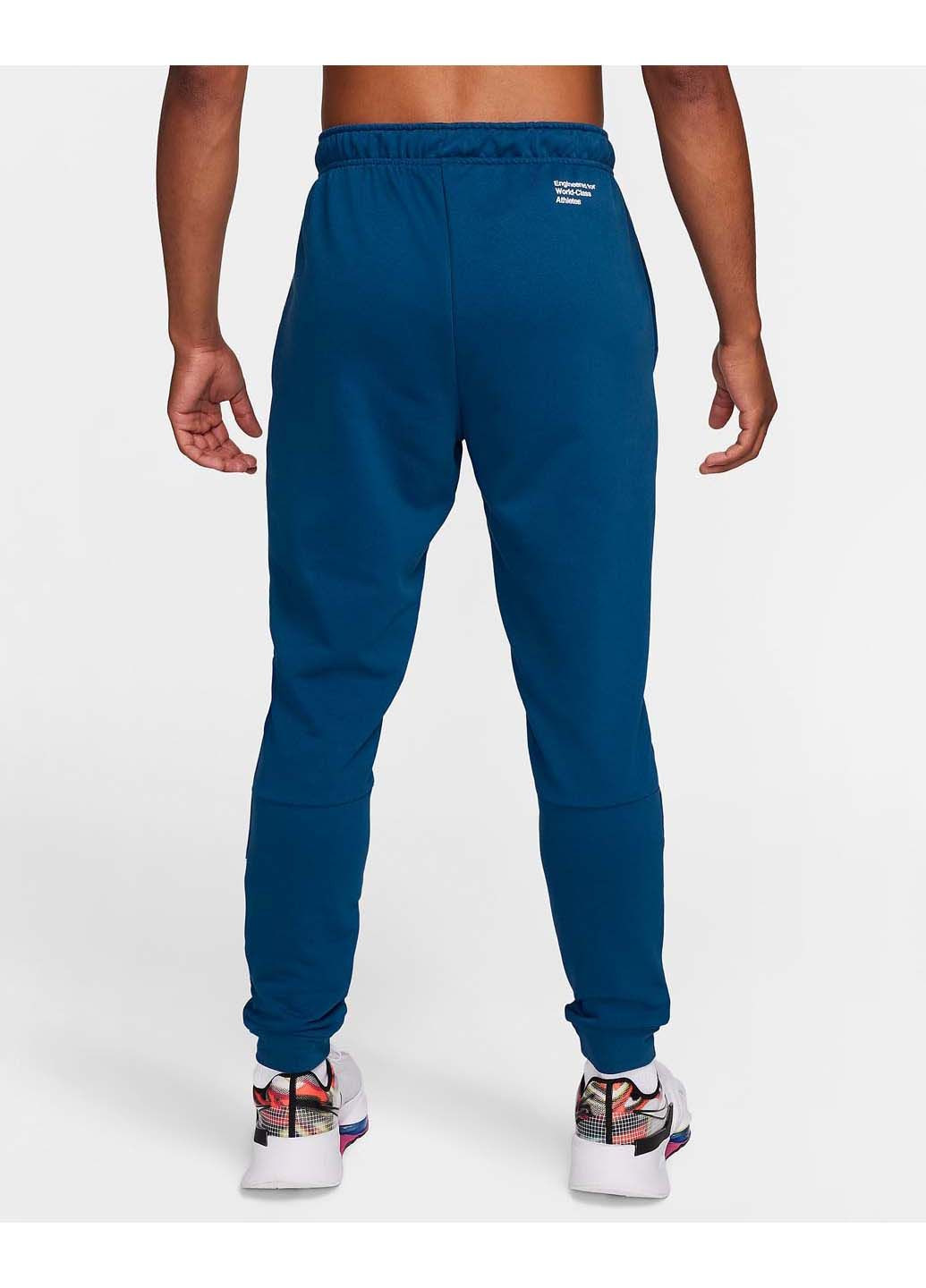 Синие демисезонные брюки Nike