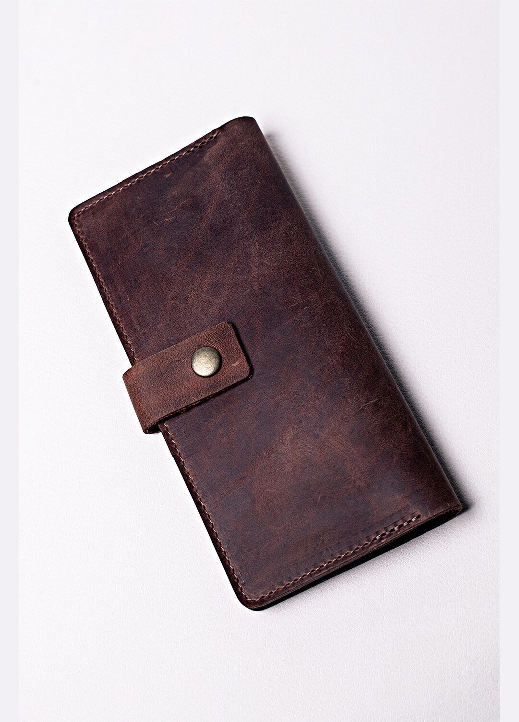 Унисекс кожаный кошелек "Крейзи" на кнопке коричневого цвета VOLMAS (316302469)