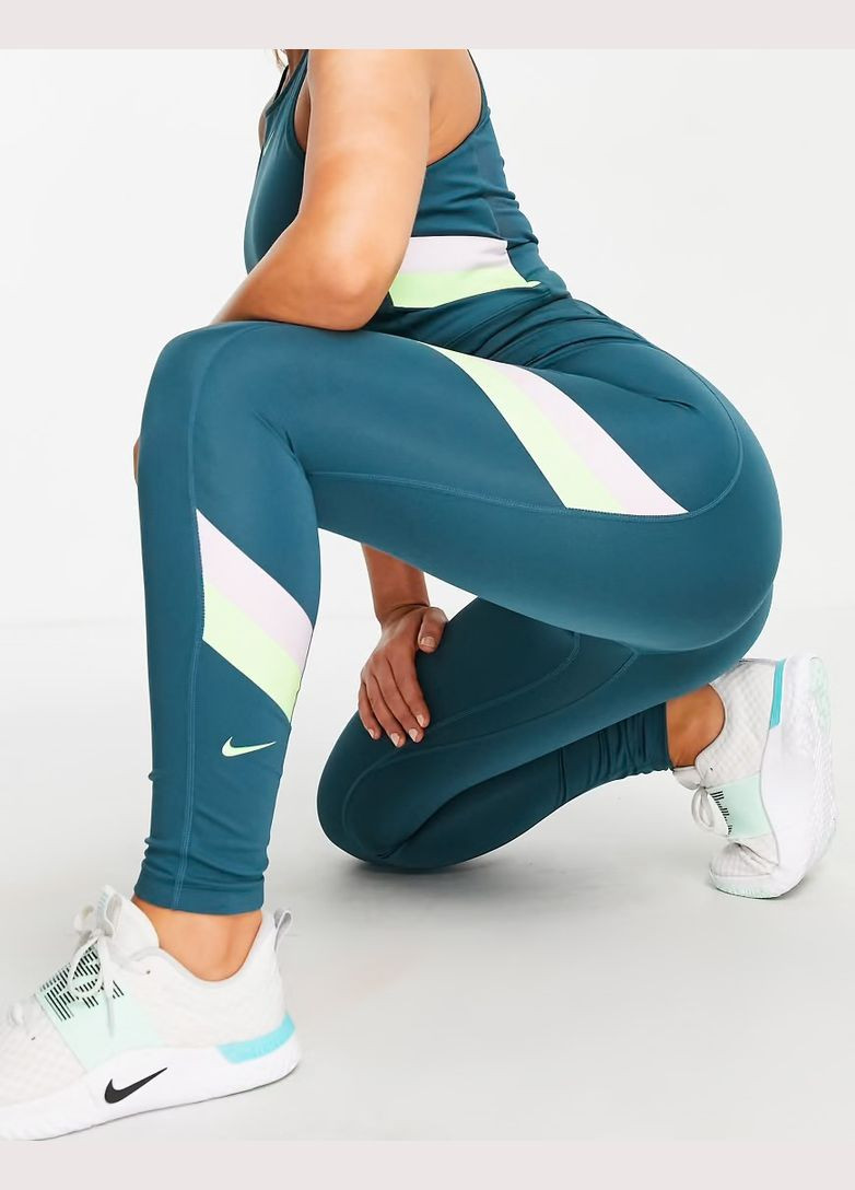 Зеленые демисезонные спортивные леггинсы Nike