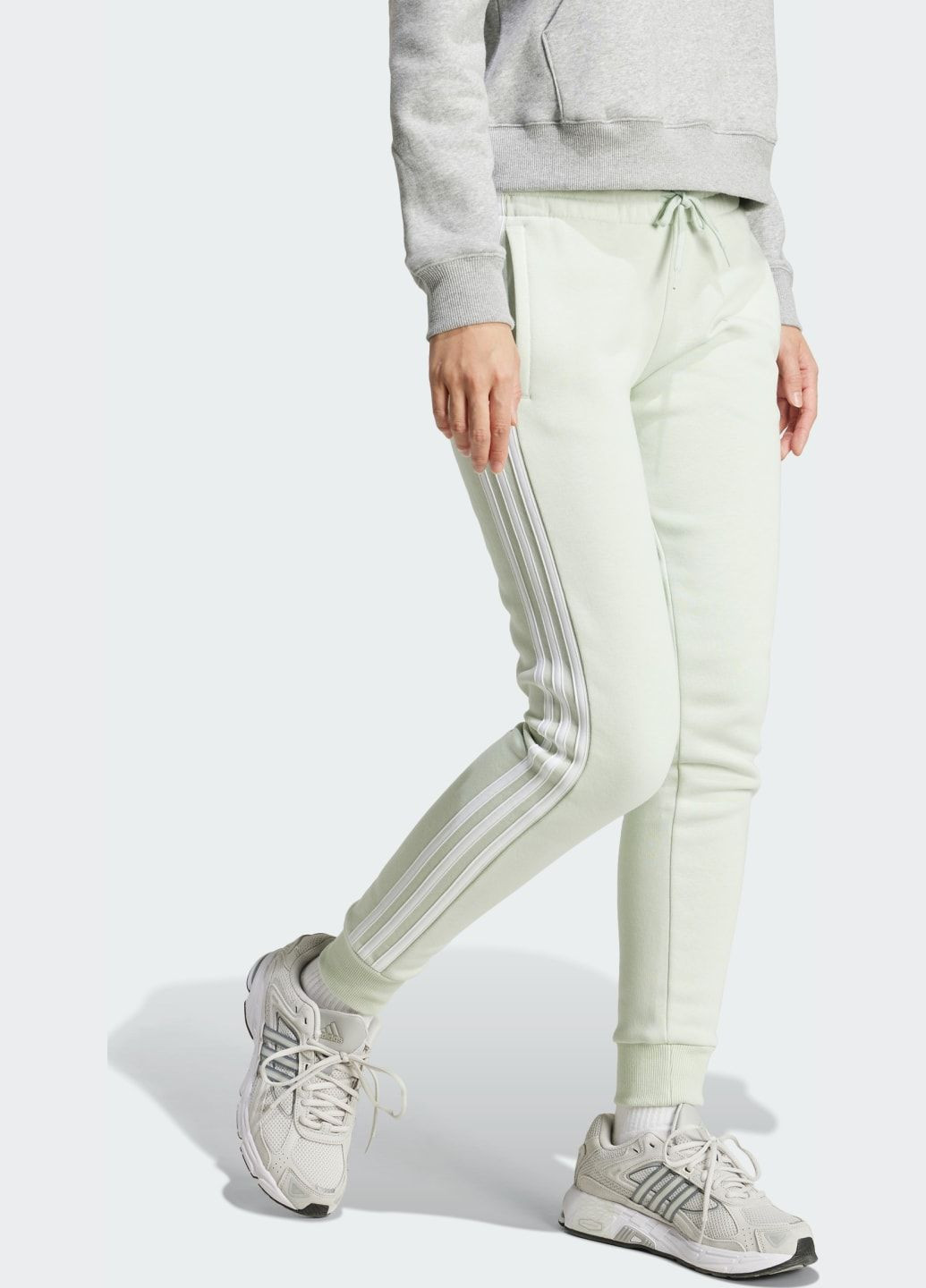 Брюки-джоггеры Essentials 3-Stripes Fleece adidas (368834349)