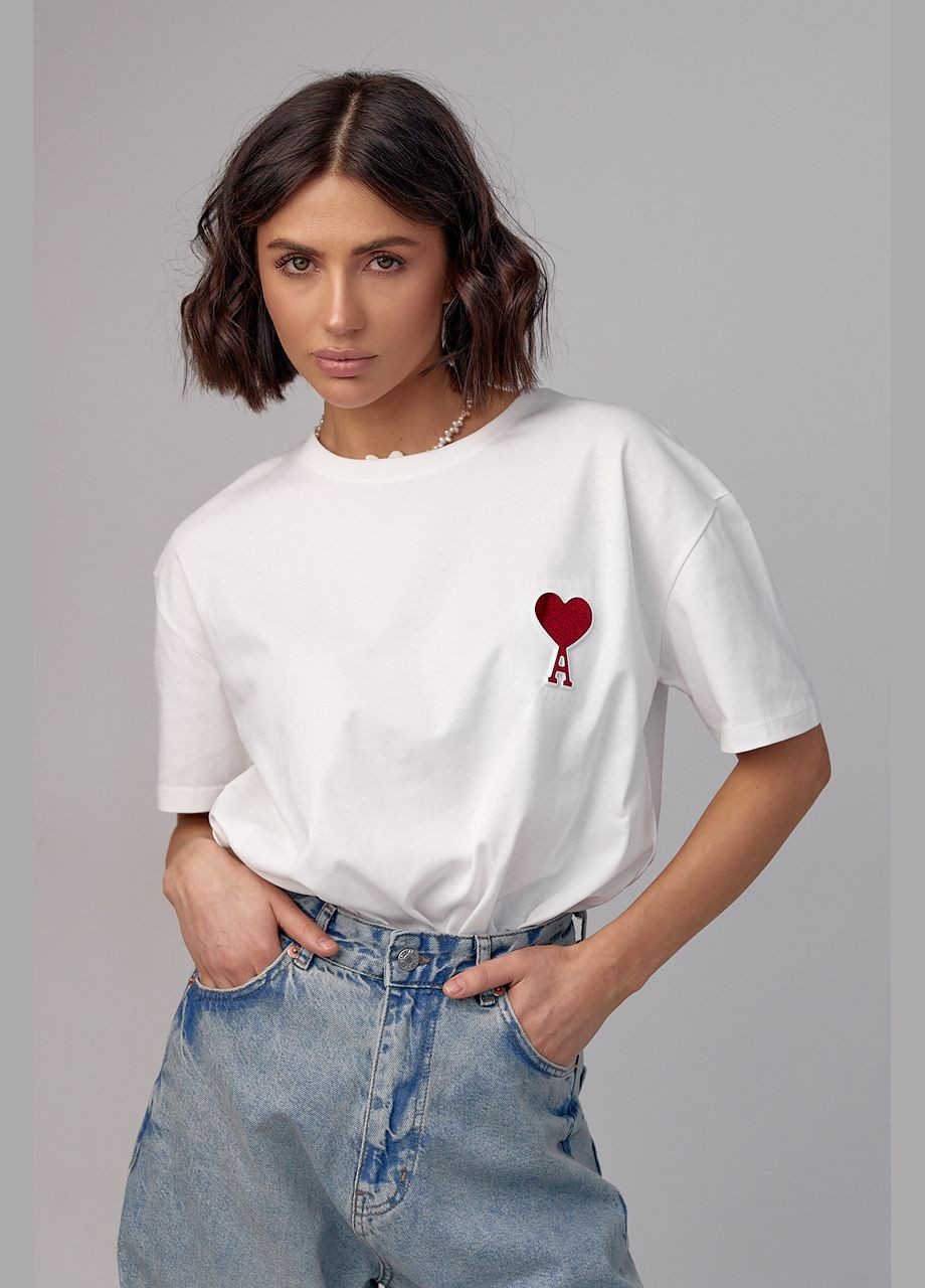 Молочна літня жіноча футболка з написом ami Lurex
