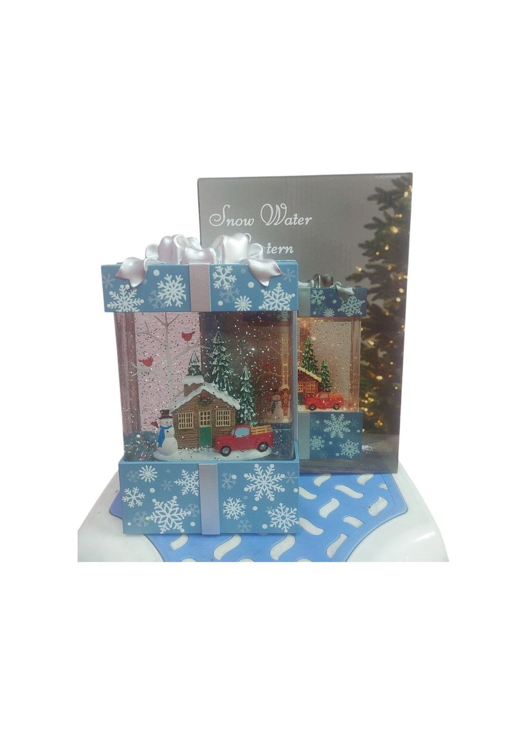 Новорічний декоративний музичний ліхтар світильник з Бантом Сніговик WDL-22018 зі снігом на батарейках та USB Блакитний No Brand (367261933)