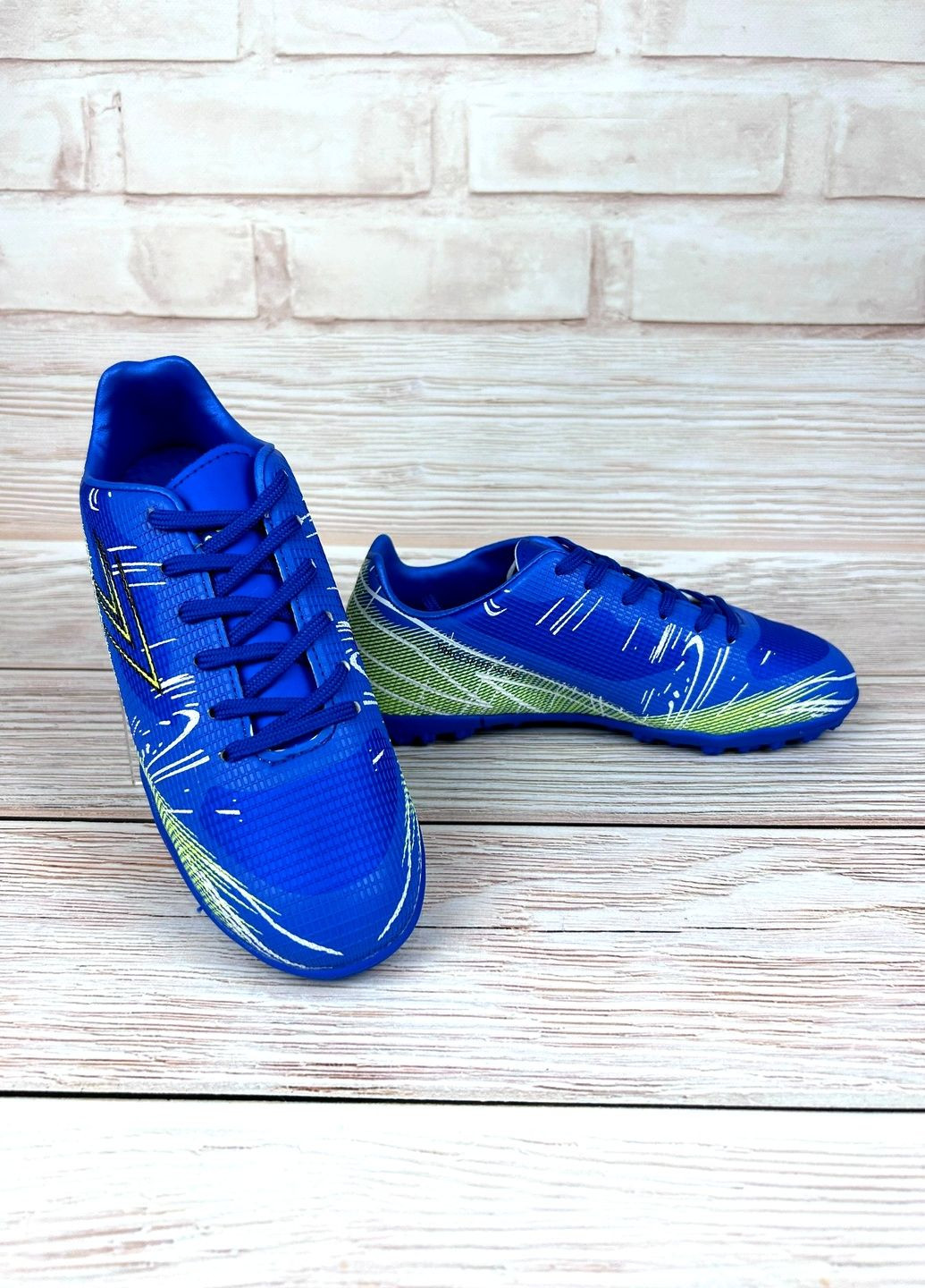 Дитячі сороконіжки сині низькі для дітей спортивні зі штучної шкіри для футболу No Brand (361970588)