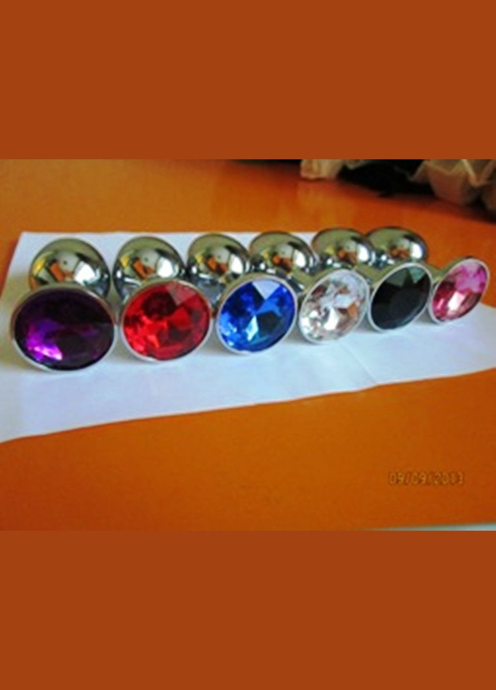 Мала анальна пробка S з червоним стразом у чохлі 2.8*7.5 см Металева No Brand (340914493)