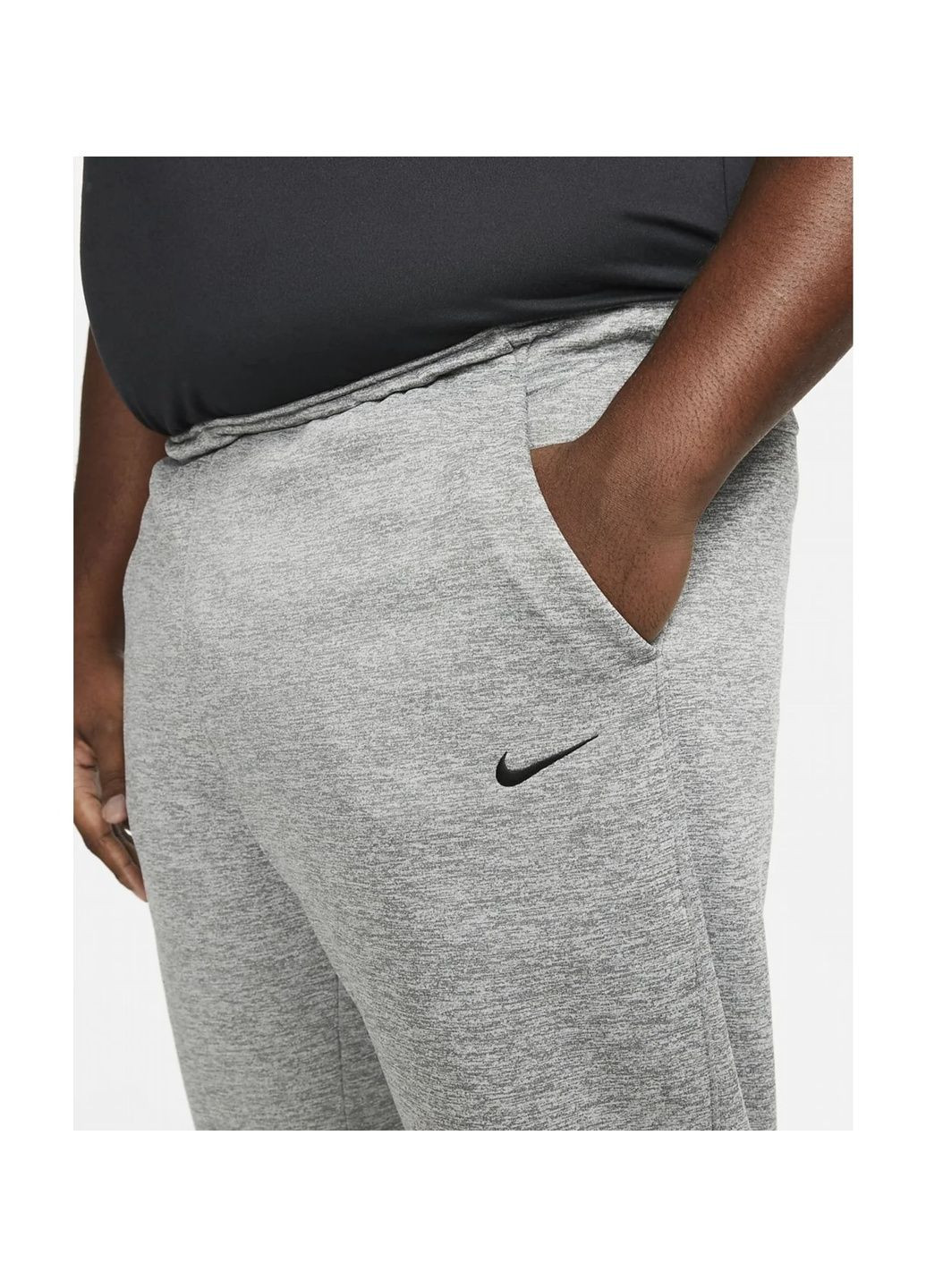 Серые демисезонные брюки Nike