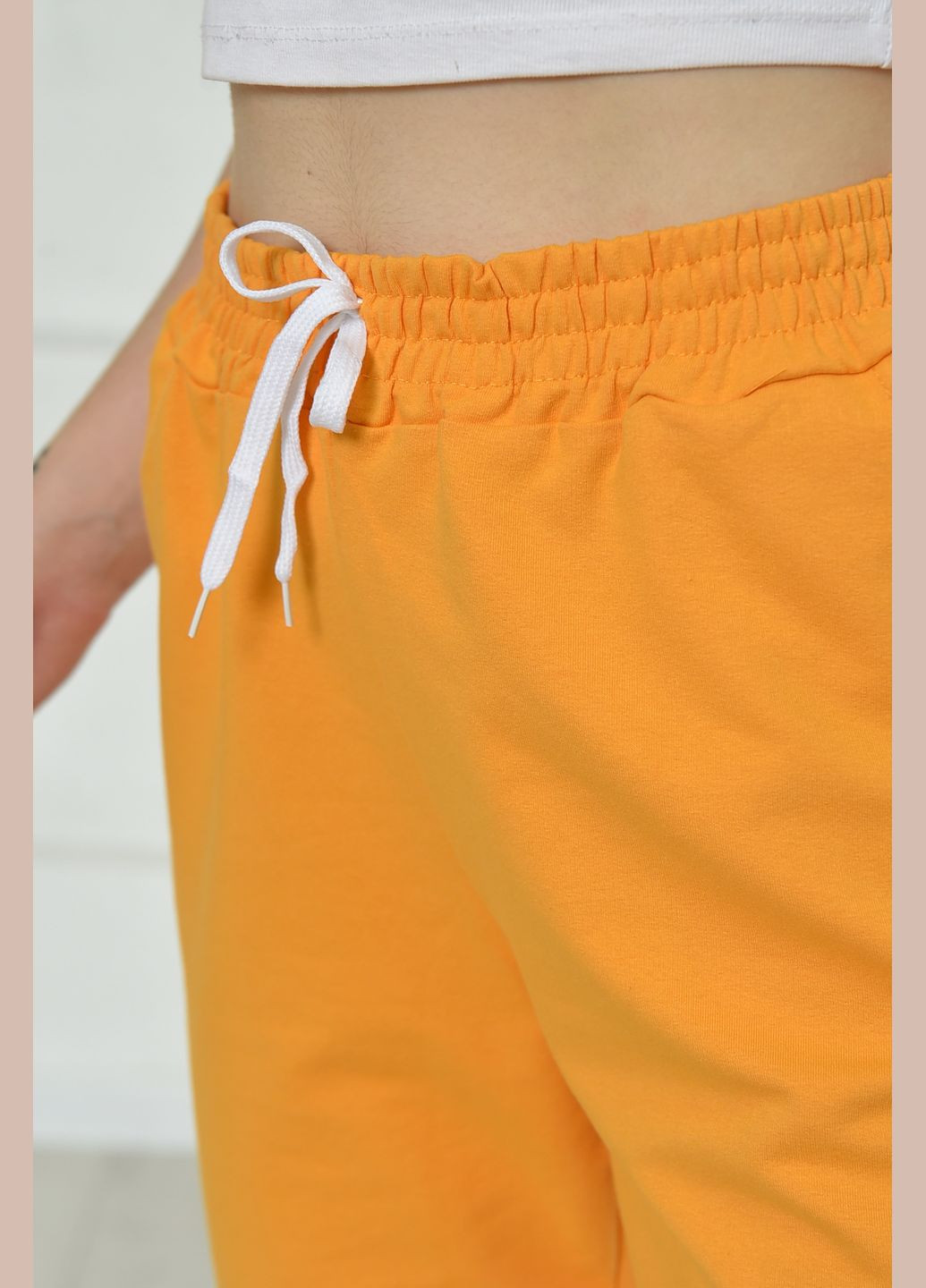 Спортивні штани жіночі жовтого кольору однотонні Let's Shop (266901163)