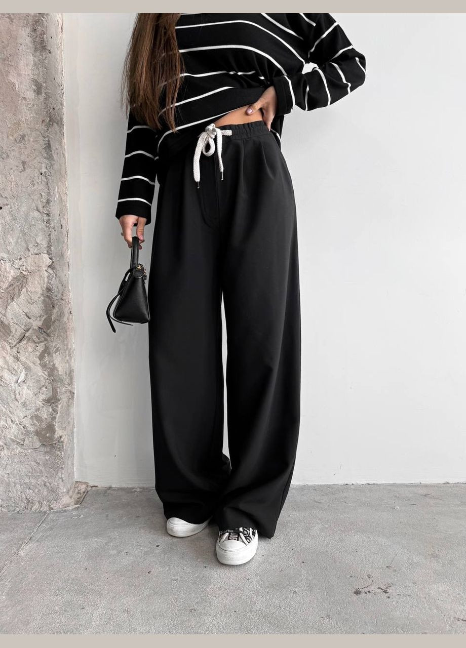 Жіночі брюки з декоративним шнурком колір чорний р.42 451517 New Trend (282928057)