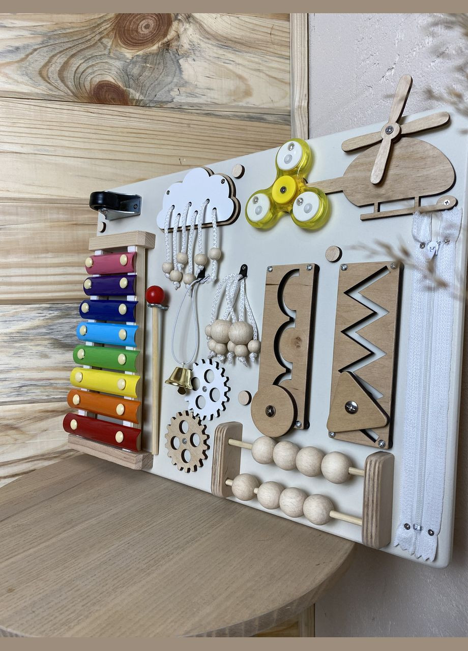 Бізіборд в кольорі дерева з ксилофоном 30х40 см No Brand (348357612)