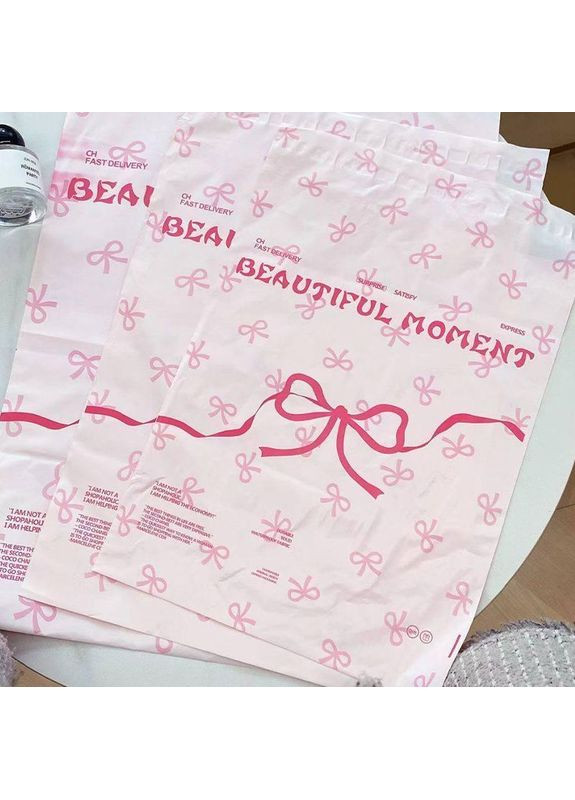 Кур'єрські пакети рожеві з бантом 28×43 см, поліетиленові пакети для відправлень, самоклеючі No Brand (366890490)