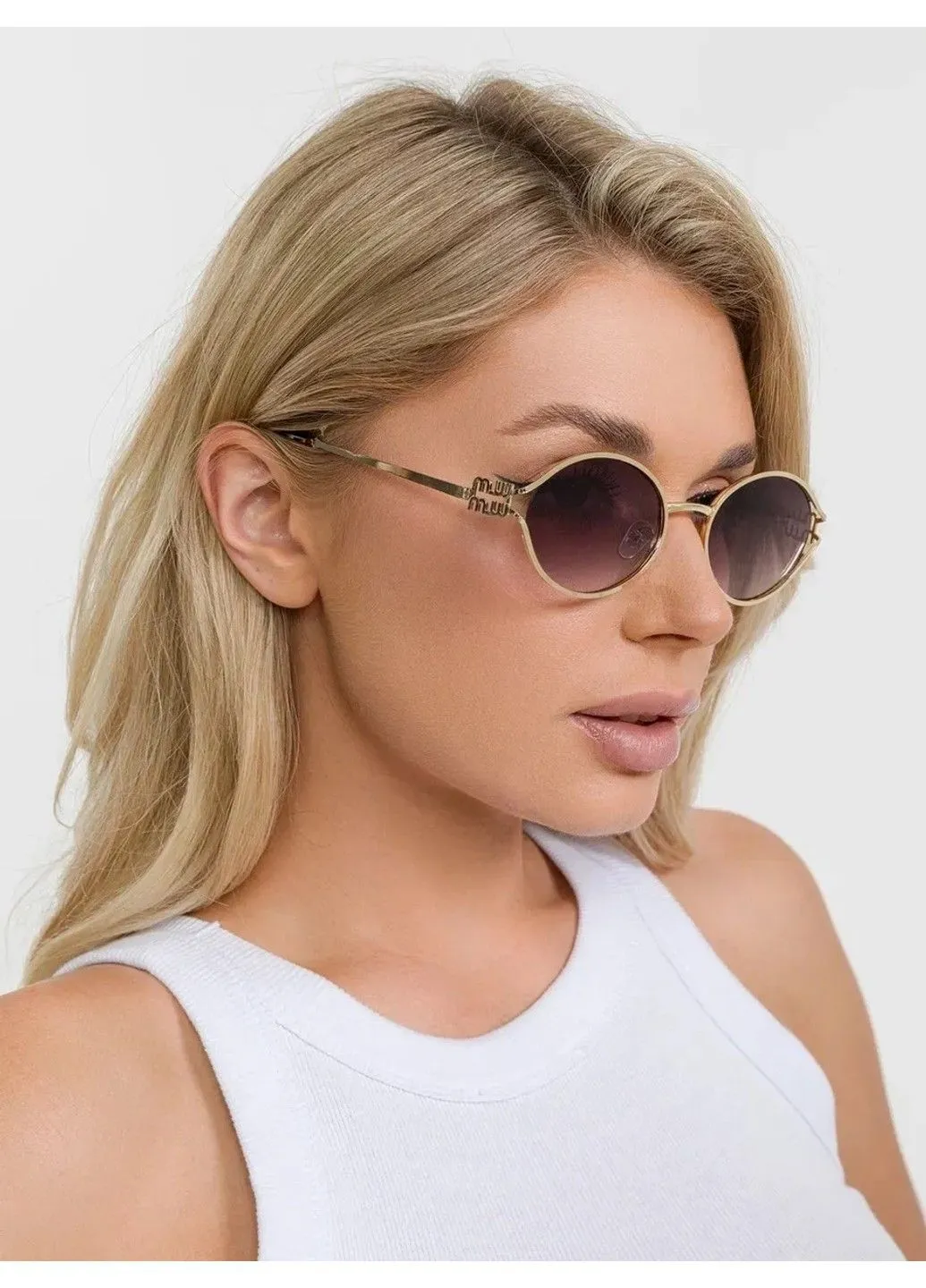 Сонцезахисні окуляри овальні Miu Miu Oval Logo градієнт сірі із золотом No Brand (382011497)